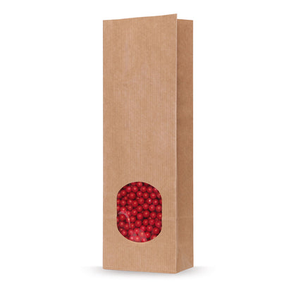Sachet à fond plat papier kraft naturel avec fenêtre transparente — vue détaillée dans une application d'emballage typique avec exemple de contenu